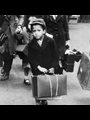 A small boy carrying his luggage as he left London for the country with a party of other evacuees on July 5, 1940.