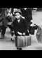 A small boy carrying his luggage as he left London for the country with a party of other evacuees on July 5, 1940.
