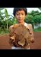 boy holding makeshift soccer ball
