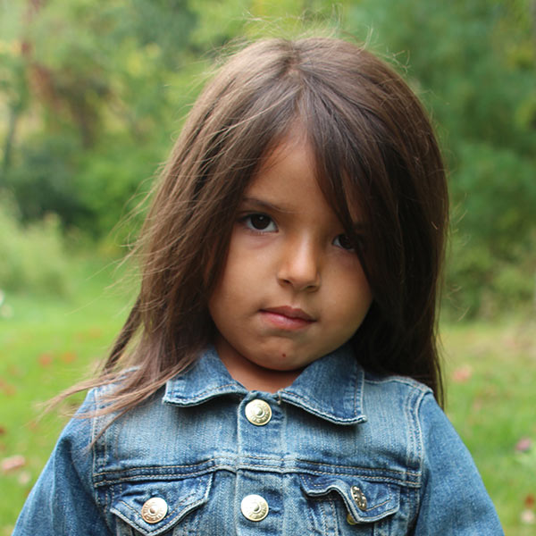 girl holding red leaf