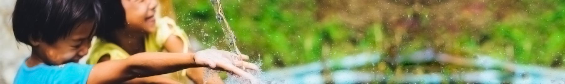 toddlers splashing water