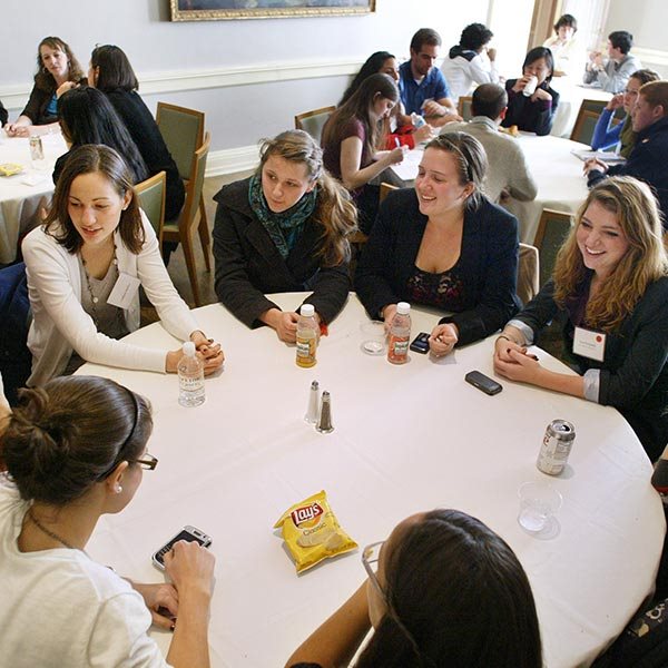 students chatting at table
