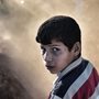 Photograph of a sad boy by Aris Messinis / Getty Images