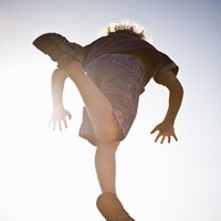 a boy leaping in the air