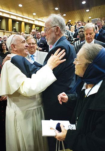 Plough author Johann Christoph Arnold and his wife Verena exchange greetings with Pope Francis