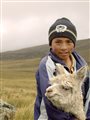 photo of boy with goat