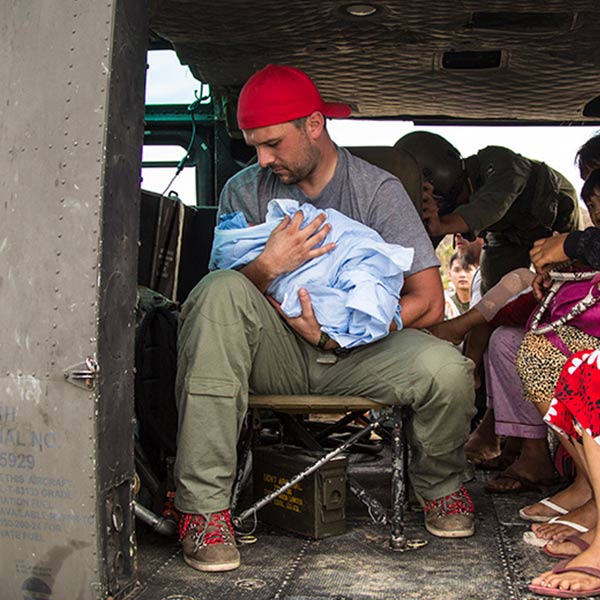 war vet holding baby in helicopter