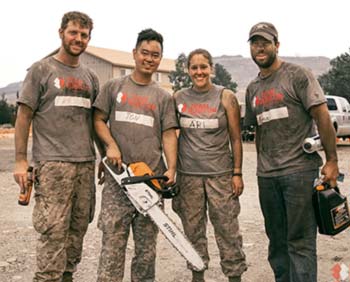 Members of team rubicon pose for photograph.
