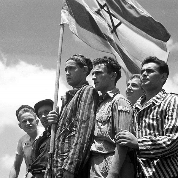 boys carrying Israeli flag