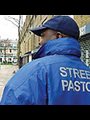 street pastor wearing blue windbreader