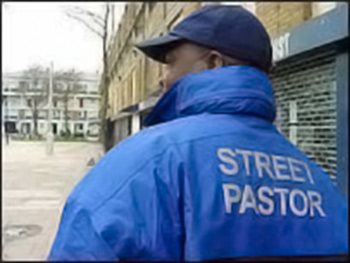 street pastor wearing blue windbreader