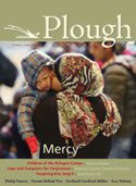refugee mother kissing child