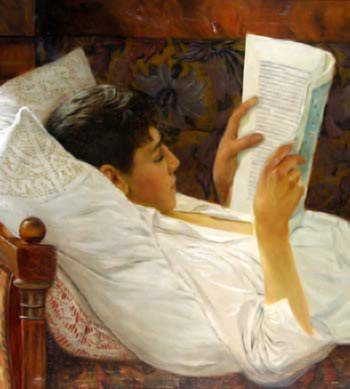 young man lying on back and reading
