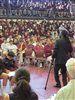 Hashim Garrett addressing an auditorium filled with attentive students