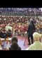 Hashim Garrett addressing an auditorium filled with attentive students