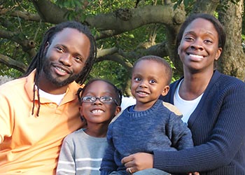 Hashim Garrett with his wife Maya and their children