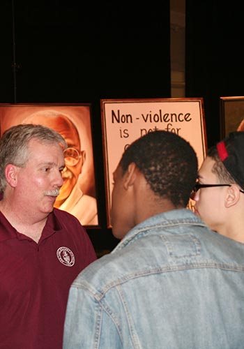 Charles Williams talking to a student