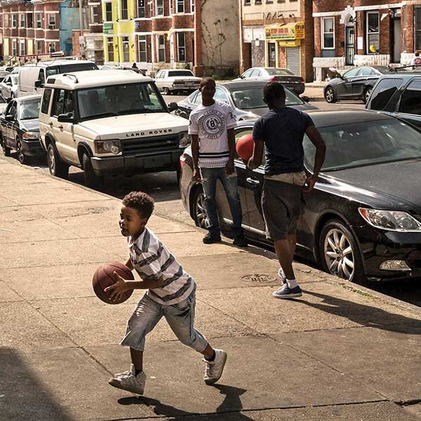 A boy plays in the Sandtown neighborhood of Baltimore