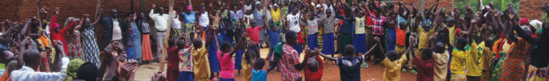 Villagers, both Tutsi and Hutu, gather to celebrate at the building site of Iriba Shalom International’s community center in Mukoma (2015).