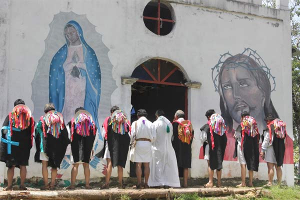 Members of Las Abejas pray outside the chapel in Acteal where the 1997 massacre took place (2013).