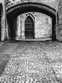 black and white photo of cobbled street