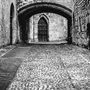black and white photo of cobbled street