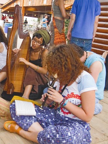 A group of young people playing instruments at Taize in France.