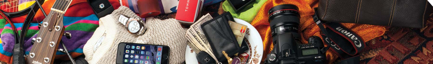 A jumble of sports equipment, electronic devices, camera, watch, clothing, etc.