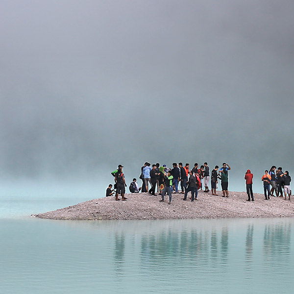 a crowd on a sandbar