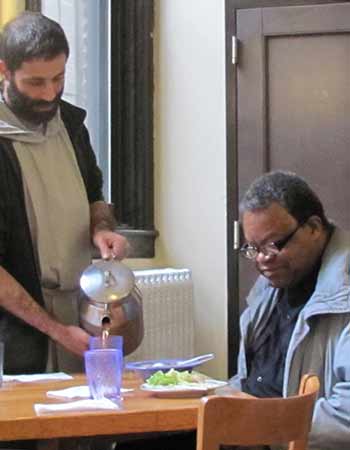 Father Gabriel serving lunch at the Thursday soup kitchen in St. Joseph Friary, Manhattan.