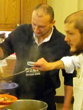 Franciscan Friars of the Renewal serve Folish soup to the hungry.