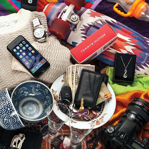 A jumble of sports equipment, electronic devices, camera, watch, clothing, etc.