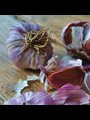 Purple garlic on a wooden cutting board