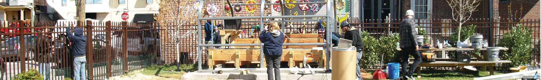 A group puts up a new greenhouse