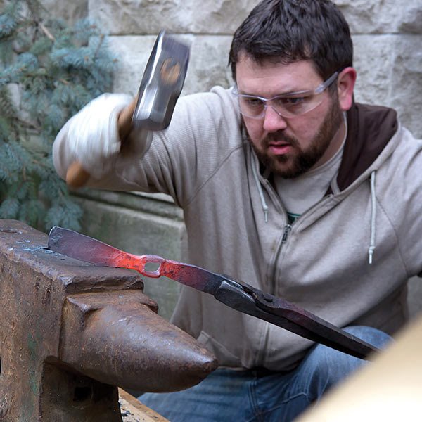 Michael Martin of RawTools working at an anvil
