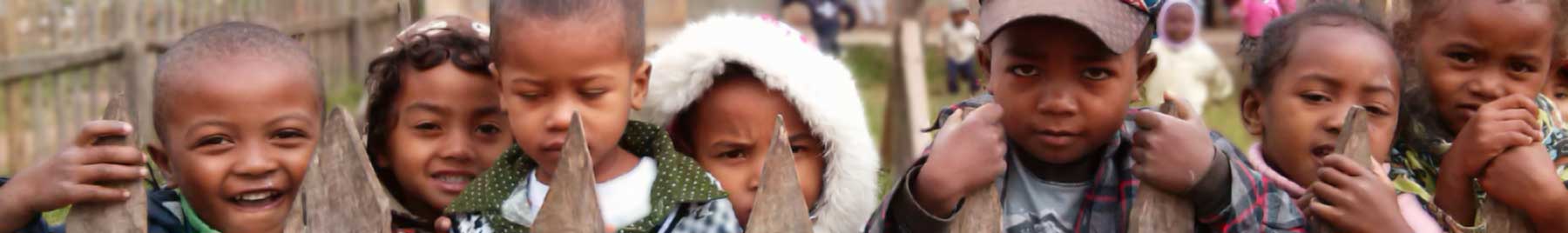 children looking over a fence