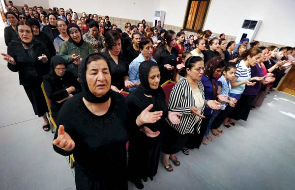 Christians who fled Mosul worship at Erbil’s Mar Shmony Church (June 2016).