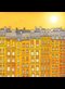 painting of a yellow row houses under a bright sun