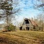 a barn in an autumn woods