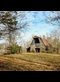 a barn in an autumn woods