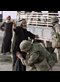 A US soldier frisking an elderly Iraqi man
