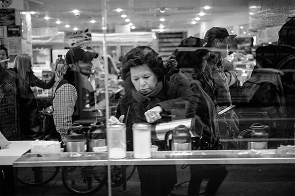 Woman at a food counter in New York City