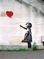 Banksy graffiti of a girl with a red balloon.