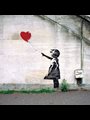 Banksy graffiti of a girl with a red balloon.