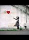 Banksy graffiti of a girl with a red balloon.