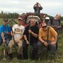 happy farmers posing with pitchforks