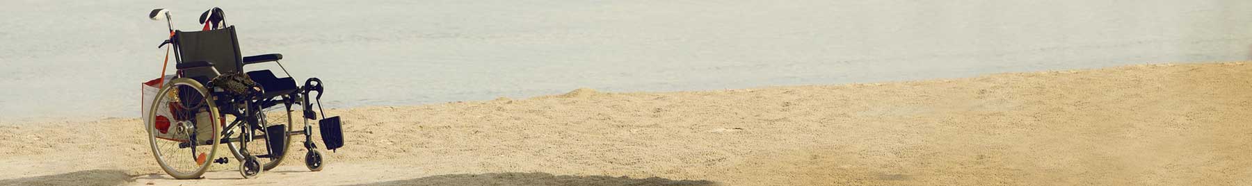 empty wheelchair on a beach