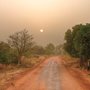 The sun shining on a dusty road in Africa