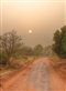 The sun shining on a dusty road in Africa