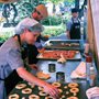 a woman making donuts